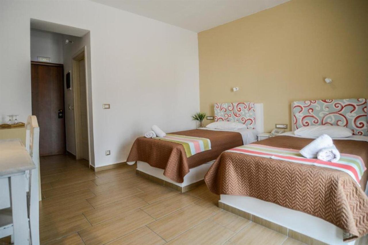 Omiros Hotel Мессария Экстерьер фото